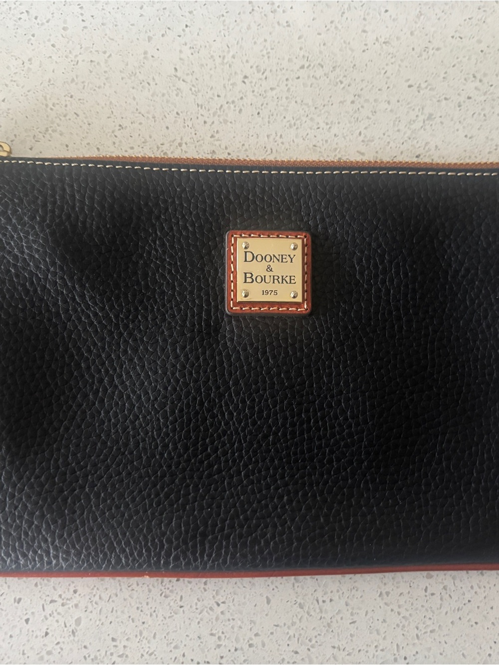 Dooney & Bourke Black Pebbled Leather Clutch with Brown Trim